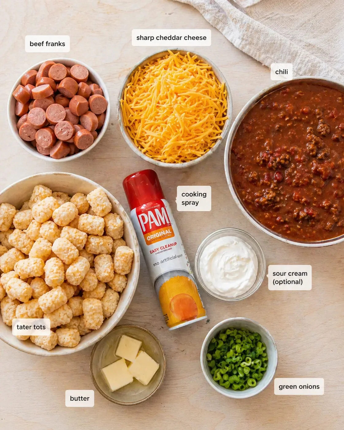 ingredients-placeholder.png Measured ingredients arranged for Best Crockpot Chili Dog Casserole - theamazingfood: 1 package beef franks (about 8-10 hot dogs, sliced into rounds), 12 oz sharp cheddar cheese (freshly shredded is best!), 4 cups chili