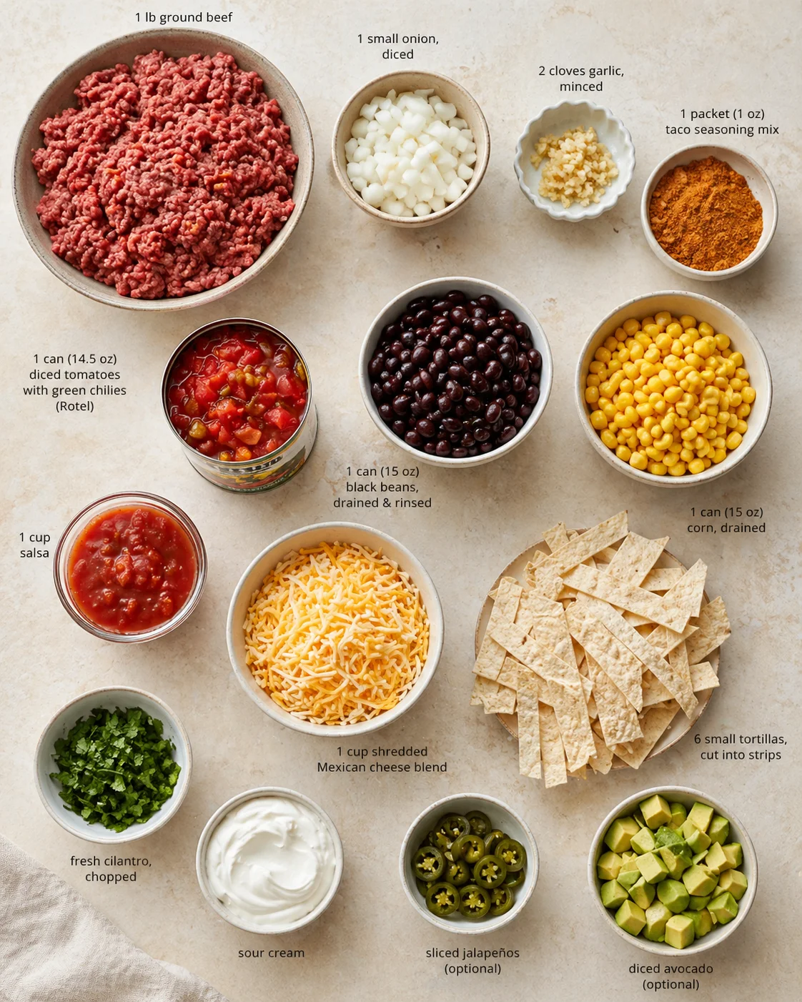 Flat-lay of taco-night ingredients arranged in bowls with labeled quantities on a light, textured counter